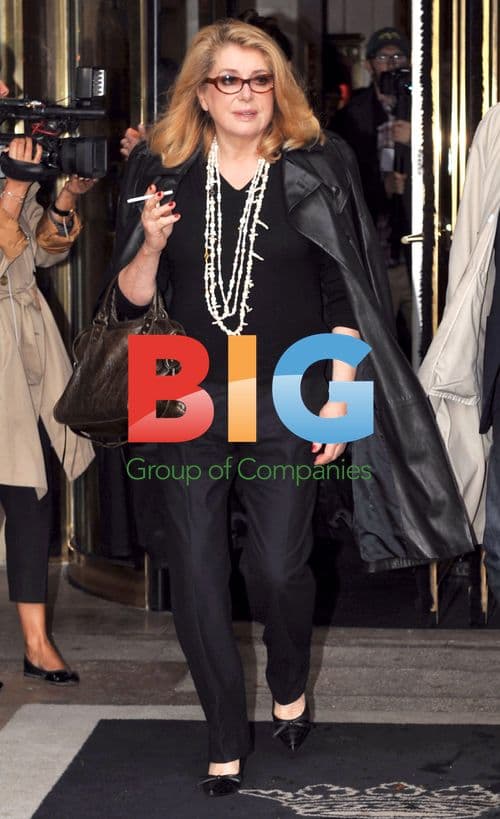 Catherine Deneuve leaves Balenciaga show