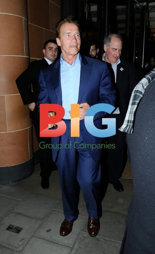 Arnold Schwarzenegger Enjoys Cigar in London