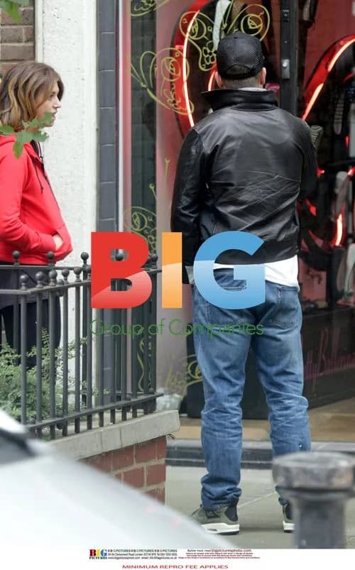 Robbie Williams Spotted with Mystery Woman
