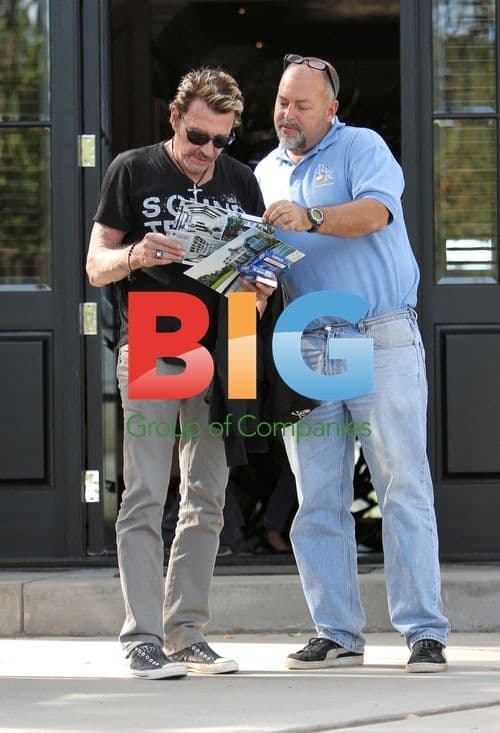 Singer Johnny Hallyday rides motorcycle