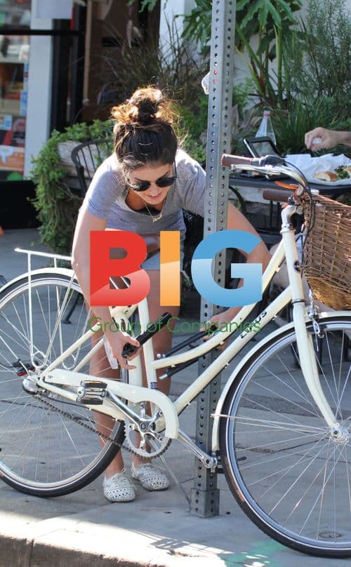 Shenae Grimes Locks Up Bike in LA