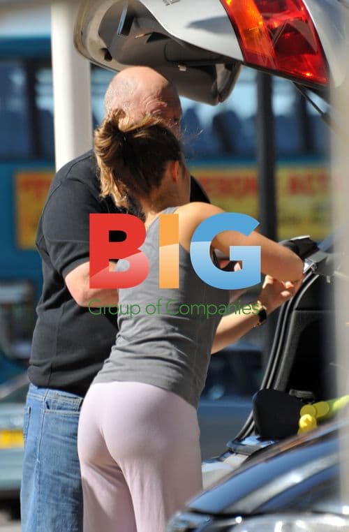 Joe and Carly Cole leaving hotel