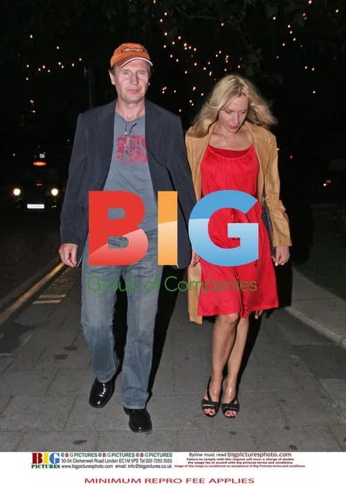 Liam Neeson with mystery blonde woman
