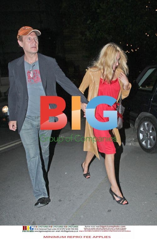 Liam Neeson with mystery blonde woman