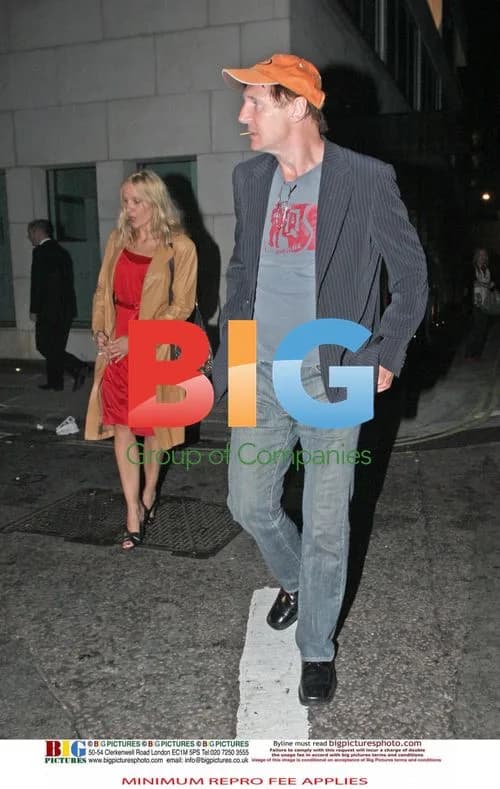 Liam Neeson with mystery blonde woman