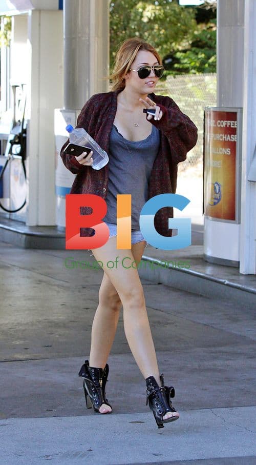 Miley Cyrus Grabs Water at Gas Station