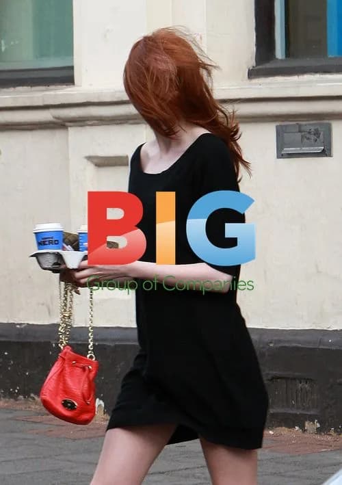 Karen Gillan battles windy weather in London