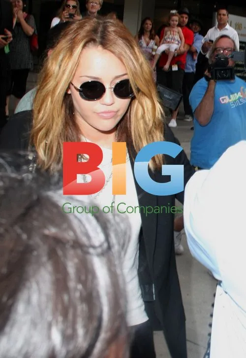 Miley Cyrus Leaving Newsroom Cafe