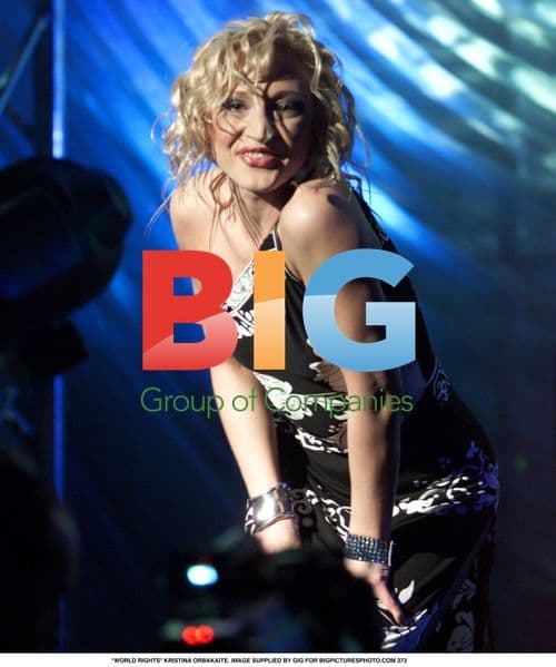 Kristina Orbakaite in black patterned dress