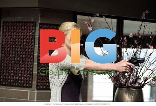 Charlize Theron in Grey Top and Black Dress