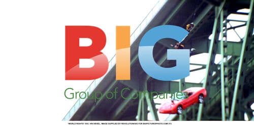 Vin Diesel posing with red Corvette