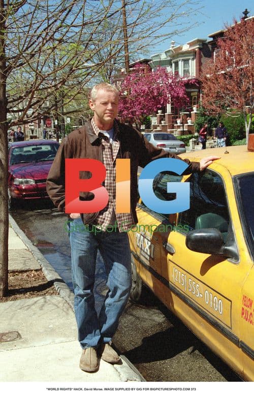 David Morse in brown jacket