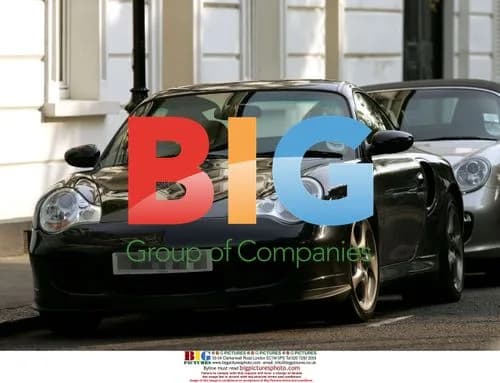 Hugh Grant excitedly returns home in new Porsche