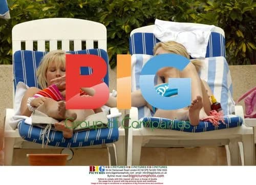 Michelle Marsh and Jo Hicks Relax by Pool
