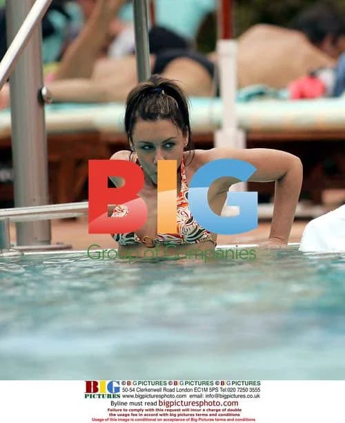 Michelle Heaton and Andy Scott-Lee by pool