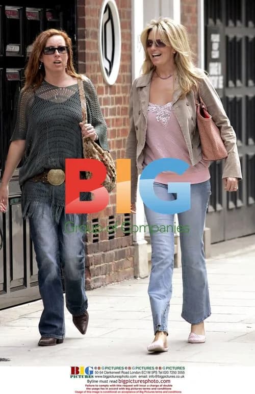 Penny Lancaster Takes Sunny Stroll with Friend