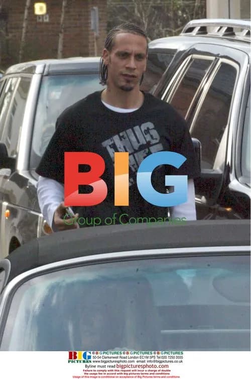 Rio Ferdinand using cash point